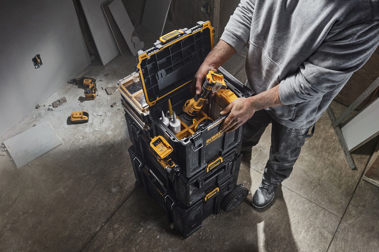 Tool being removed from DEWALT TOUGHSYSTEM 2.0 Deep Compact Toolbox.