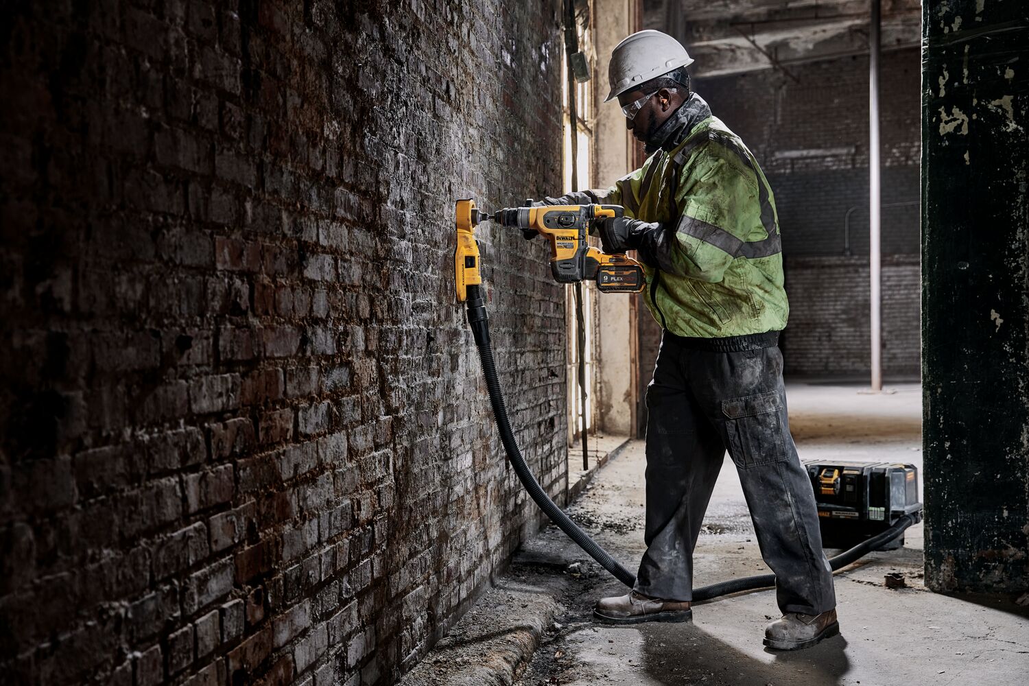 60 volt 1 and quarter inch brushless cordless S D S plus rotary hammer tool being used by a person.