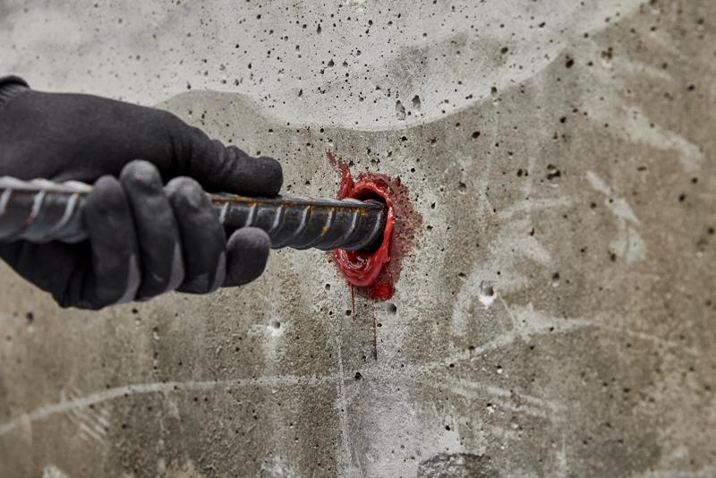 Rebar dowel being installed into concrete using Pure220+