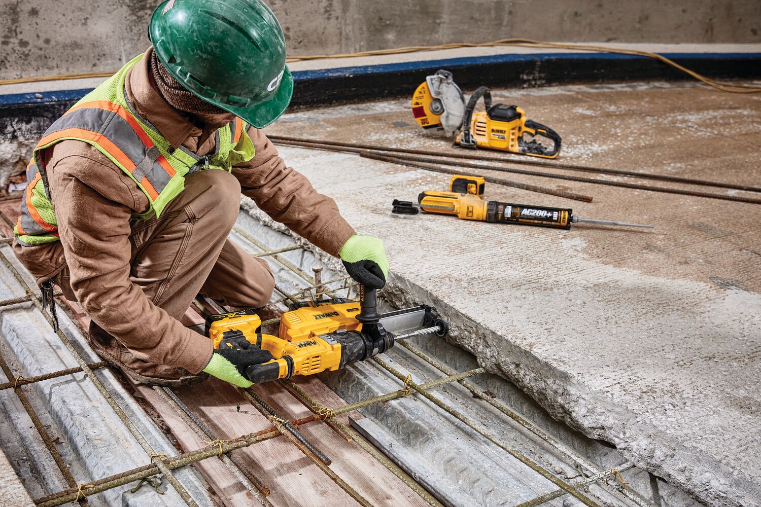 Close up of Dust extractor being used by a person to drill.