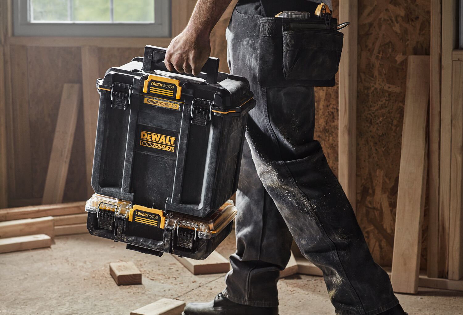 DEWALT TOUGHSYSTEM 2.0 Deep Compact Toolbox being carried into a worksite.
