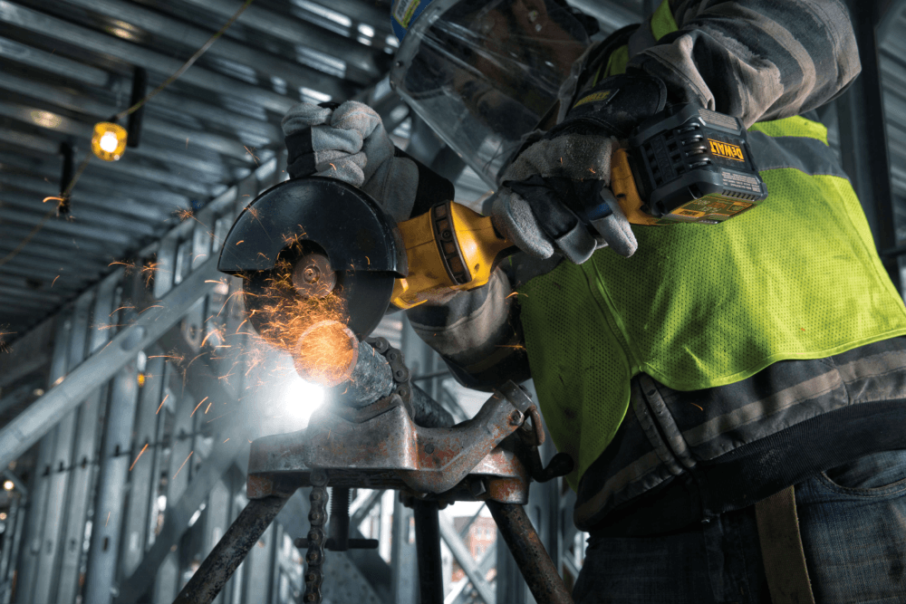 profile of GRINDER 1 BATTERY with an abrasive wheel attachment in action