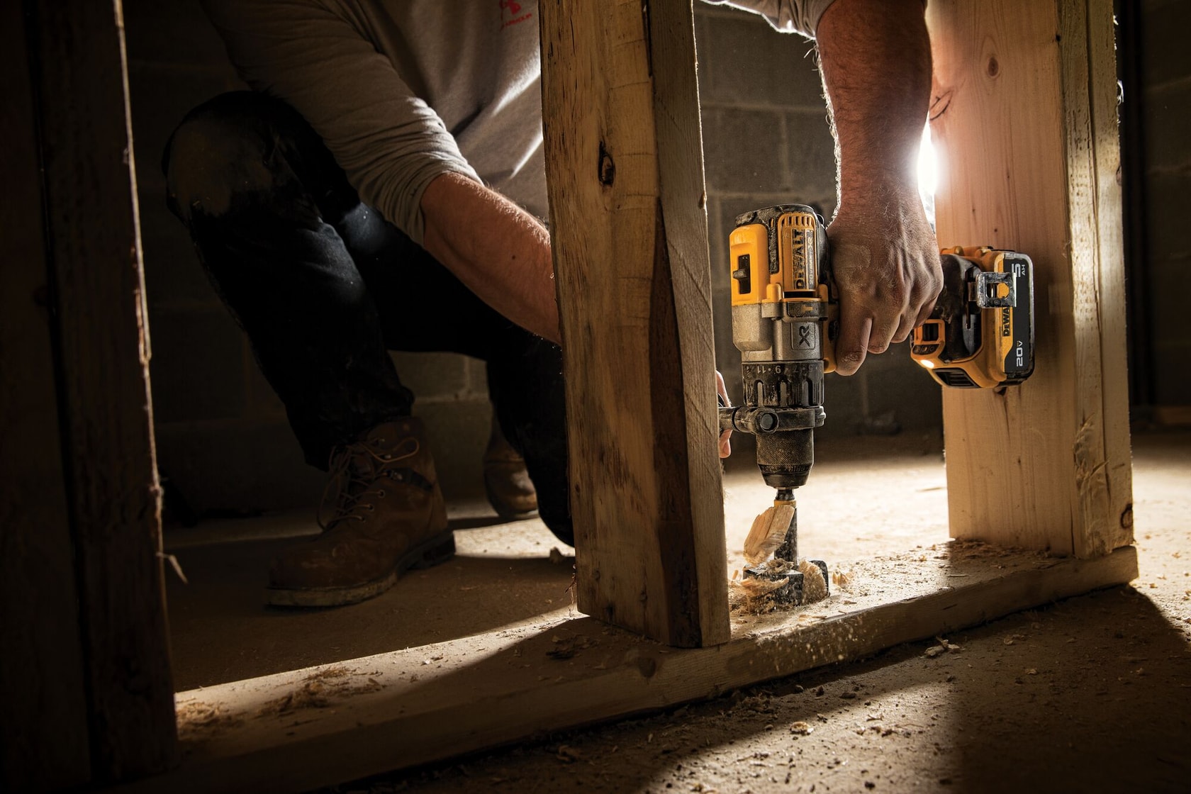 The 20V MAX* XR® Brushless Cordless 3-Speed 1/2 in. Hammer Drill/Driver Kit drilling into wood material