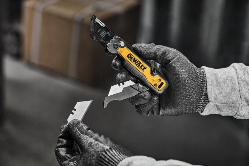 DEWALT knife being flipped open with one handed push to release